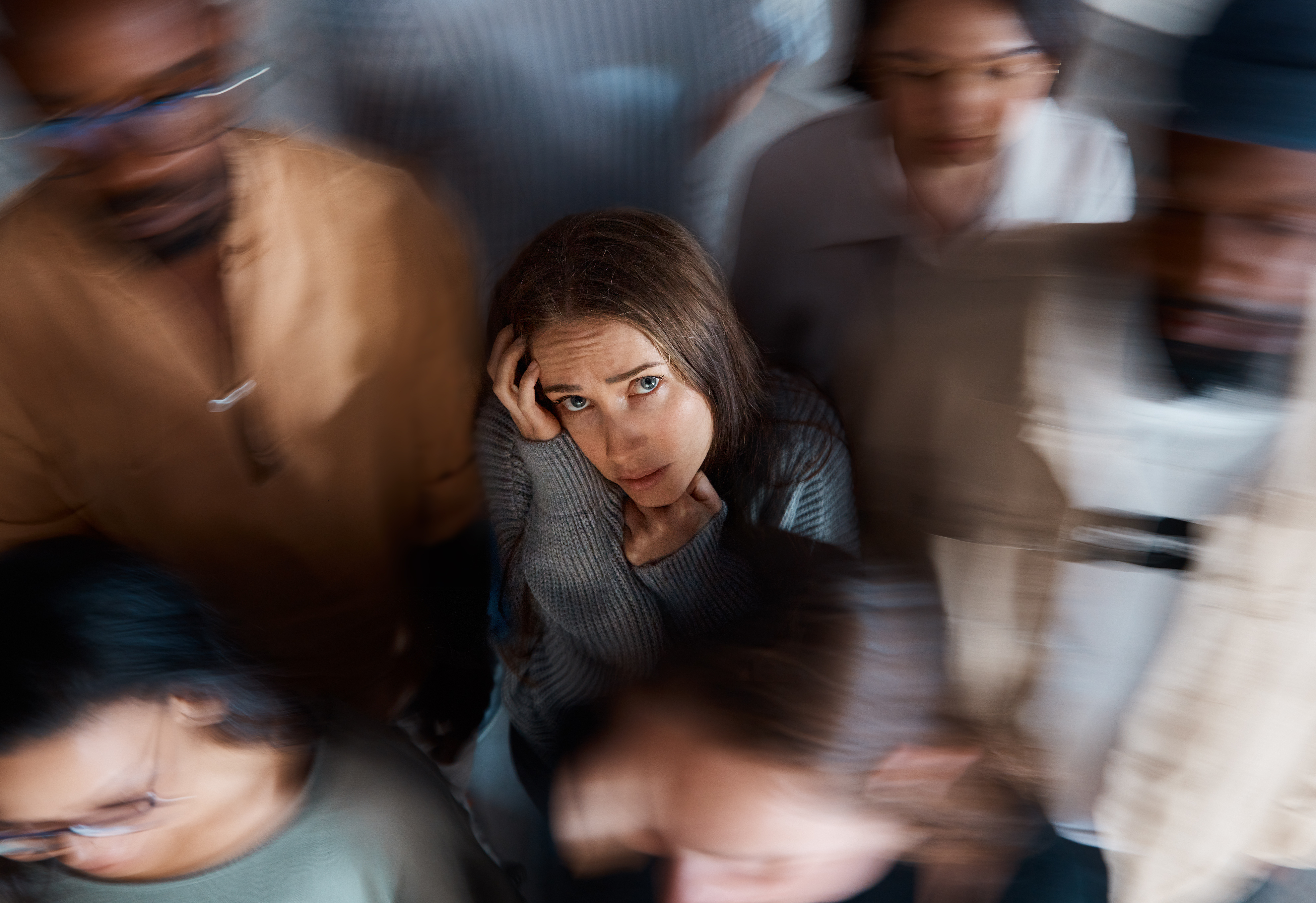 supporting student anxiety. Woman in a crowded room.